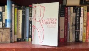 Poetry book, Eruption Sequence, faces out on a bookshelf