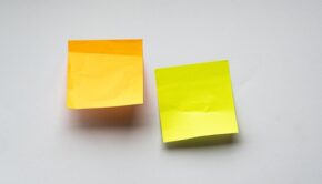 Two blank post-it notes on a wall
