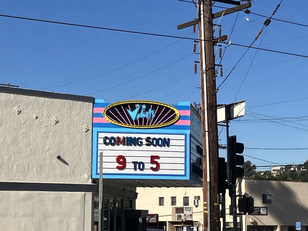 Marquis of Vidiots theater says "Coming Soon 9 to 5"