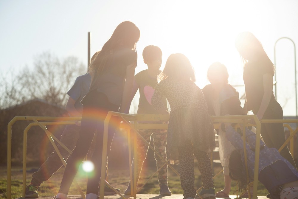 Children playing on a merry-go-round