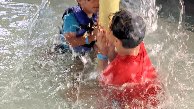 Children splashing in a pool