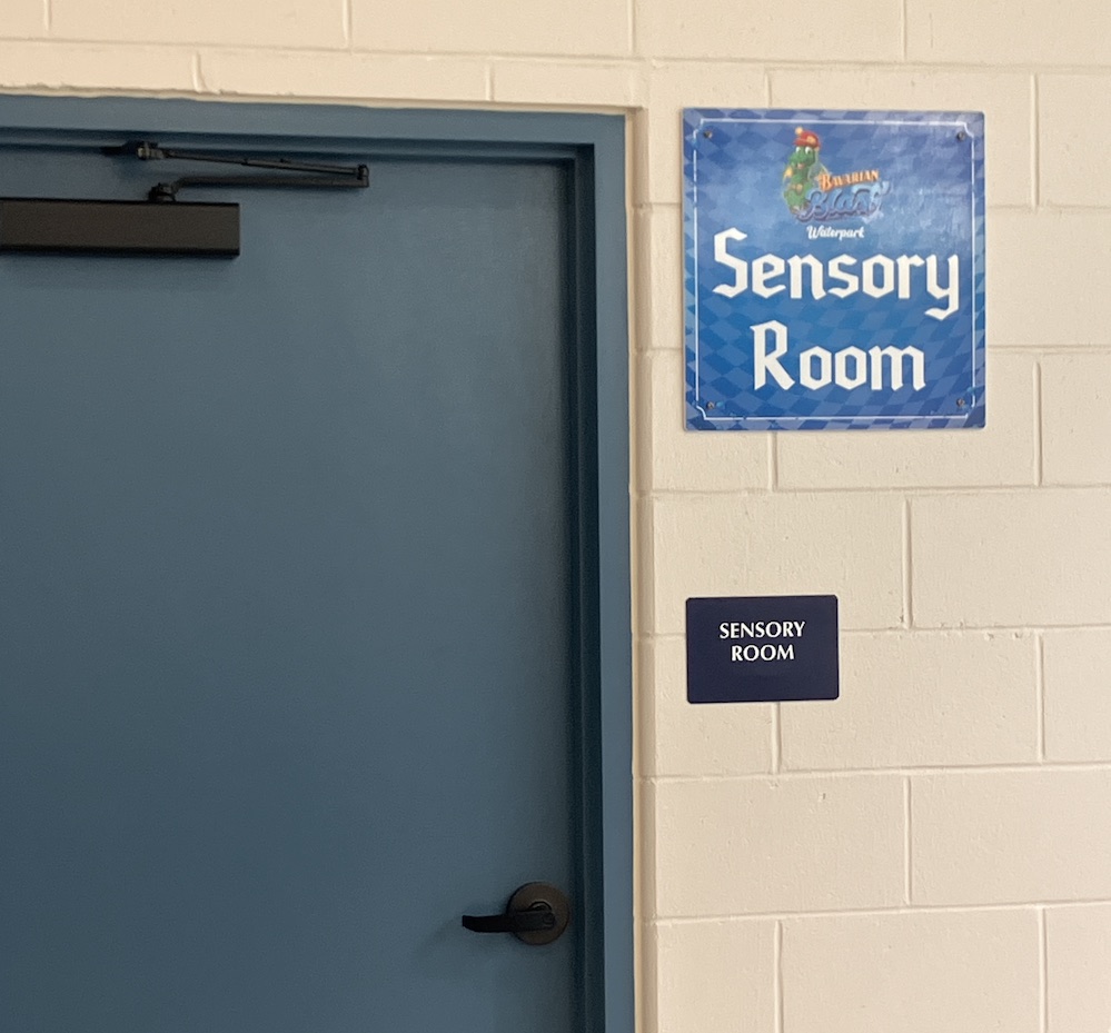 Blue door with a sign that says Sensory Room next to it