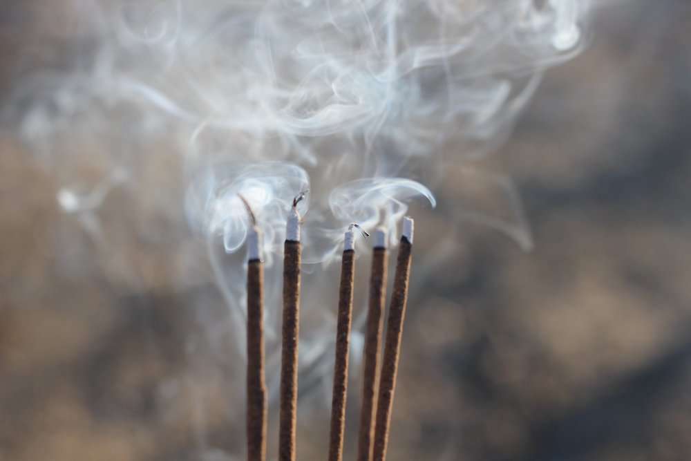 Five smoking incense sticks